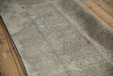Distressed vintage Turkish Tabriz design carpet with machine-bound side and worn texture.