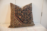 Intricate pattern details of the antique Fereghan rug pillow, showcasing rich navy, terracotta, and ivory tones.