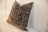 Hand-knotted vintage rug fragment pillow featuring rich navy, rust, and ivory Fereghan pattern.
