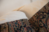 Hand-knotted pile and navy, red, ivory pattern of antique Persian Fereghan rug pillow.