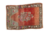 Distressed Oushak rug with floral bouquet and prayer motif on an abrashed red field.