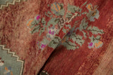 Distressed Oushak rug pile with abrashed brick red, seafoam green florals and zig-zag.