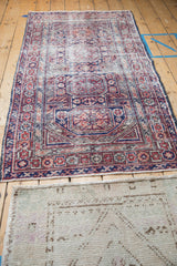 Full view of the vintage Anatolian runner, highlighting its geometric design and softened colors.
