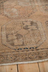Vintage Distressed Ersari rug with worn floral guls, coffee brown, and subtle dark blue accents.