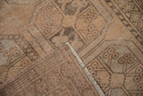 Distressed Ersari rug folded corner, showing textured guls and neatly secured selvage.
