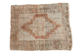 Distressed Anatolian rug featuring a blush medallion, tree-of-life spandrels, and muted ivory blue tones, 2'11