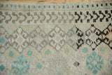 Even wear across the knot heads of a distressed Turkish Oushak rug mat.
