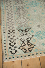 Evenly worn pile texture and geometric border detail on a vintage Oushak rug mat.