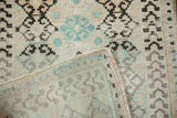 Hand-knotted foundation and secure side cord of a vintage Turkish Oushak rug mat.