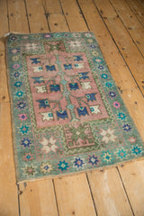 Distressed Oushak rug: germinating tree of life, serrated blossoms in blush, blues, and greens.
