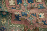 Distressed Oushak rug pile, dusty blush, blues, greens; serrated patterns, faint foundation.
