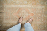 Scale and soft texture of a vintage distressed Oushak rug with sandalwood and ivory hues underfoot.