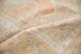 Evenly worn, low pile texture of a vintage Turkish Oushak rug in sandalwood and ivory.