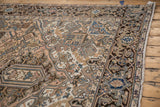 Distressed Mehrivan carpet corner with serrated patterns, subtle blue, beige, and olive.