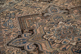 Distressed Vintage Mehrivan carpet close-up, featuring low pile and geometric blue, dusty rose patterns.