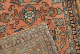 Vintage Lilihan rug's detailed hand-knotted foundation and tattered end with floral pattern.