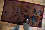 Vintage Chinese Art Deco rug with a pictorial scene, shown from a personal perspective.