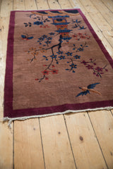 Angled view of a pictorial Chinese Art Deco rug, showing the entire scene.