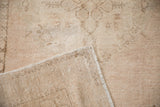 Hand-knotted foundation and secured selvage of a vintage Turkish Oushak rug's folded corner.