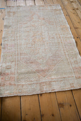 Reverse view of the vintage Oushak rug showing the hand-knotted foundation and weave.