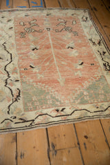 Distressed pale ruby red grapefruit field with germinating tree-of-life motif, ivory serrated border.