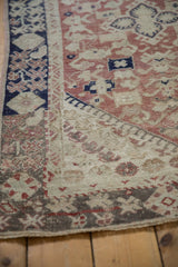 Worn border detail of vintage Anatolian rug with geometric pattern and blush hues.