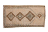 Distressed vintage Anatolian rug: triple medallion, prayer niche, ivory, bronze, silver, worn pile.