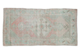 Distressed Oushak rug, faded blush-mint green palette, stepped medallion, arabesque border, 2'5