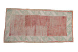 Distressed Anatolian runner with a raspberry lattice field, heavy abrashes, and a pale mint leaf border.