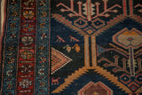 Hand-knotted Antique Malayer rug: navy blue field, madder red border, geometric birds, plant motif.