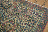 Vintage Kerman rug detail, ivory thousand flower pattern, pale red, blue, green, subtle wear.