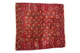 Antique Turkmen square rug featuring a dense field of geometric guls in burgundy red and navy.