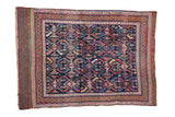 Antique Afshar rug with a geometric leaf pattern in red and blue, featuring a striped plain weave end.