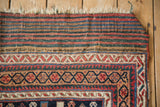 Original striped plain weave skirt and fringe of a late 19th-century Persian Afshar rug.