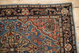 Intricate Josan style border with meandering vines in navy blue, sky blue, and dusty blush.