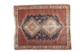 Vintage Afshar square rug with ivory and navy diamond medallions on a madder red field.