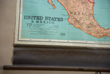 Vintage Nystrom map with Mexico's tan coast, title, textured brown canvas, and wooden dowel.