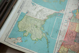 Vintage Nystrom map section with pastel blue Arctic Ocean and pale orange Asia.