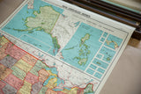Close-up of vintage Nystrom map showing central US states, Great Lakes, and Canada, pastel tones.