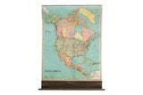 Vintage Nystrom pull-down map of North America, pastel lands, teal oceans, 40