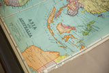 Vintage Nystrom map detail of Southeast Asia, Australia, with visible creases and aged paper.