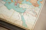 Vintage Nystrom pull-down map showing the Middle East with light blue seas and worn edge.