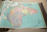 Lower right detail of the vintage Nystrom map, showing the teal South Atlantic Ocean and wood dowel.