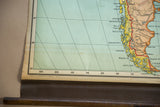 Vintage Nystrom map's lower left, showing coordinates, copyright, wooden dowel, and subtle creasing.