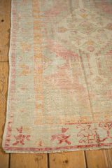 Intact side cord selvage and worn pile on a vintage distressed Turkish Oushak rug.