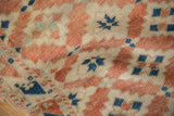 Distressed texture and terracotta, ivory, dusty blue diamond guls on vintage Dosemealti rug.