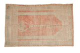 Distressed Oushak prayer rug in a soft palette of blush, ivory, and faded turquoise.