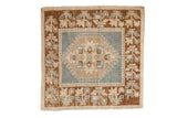 Distressed Oushak square rug with floral medallion, plant border, dusty blue, copper, ivory tones.