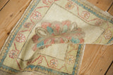 A soft fold showing the even wear and hand-knotted texture of a vintage Oushak mat.