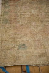 Textural detail of distressed Oushak rug, revealing worn pile, knot heads, and time-softened tones.